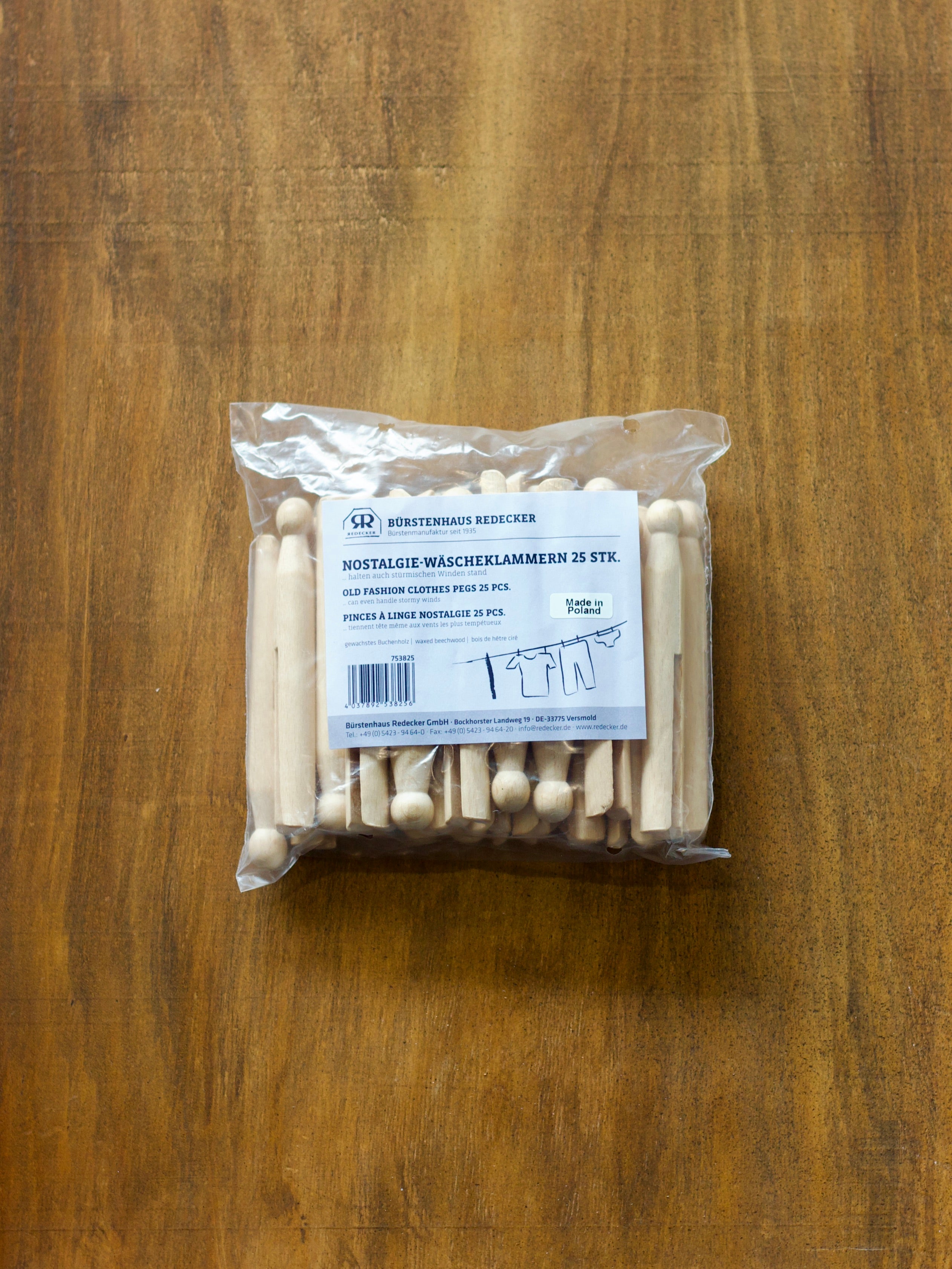 Redecker packaged wooden clothes pegs on a wooden surface