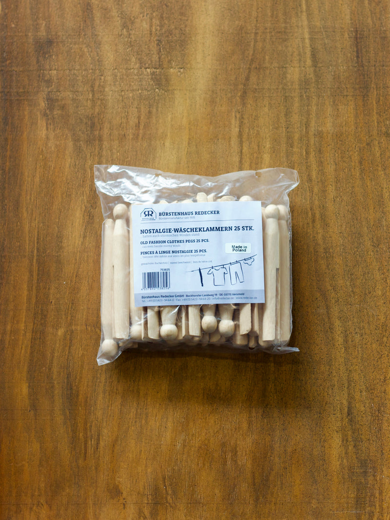 Redecker packaged wooden clothes pegs on a wooden surface