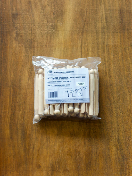 Redecker packaged wooden clothes pegs on a wooden surface