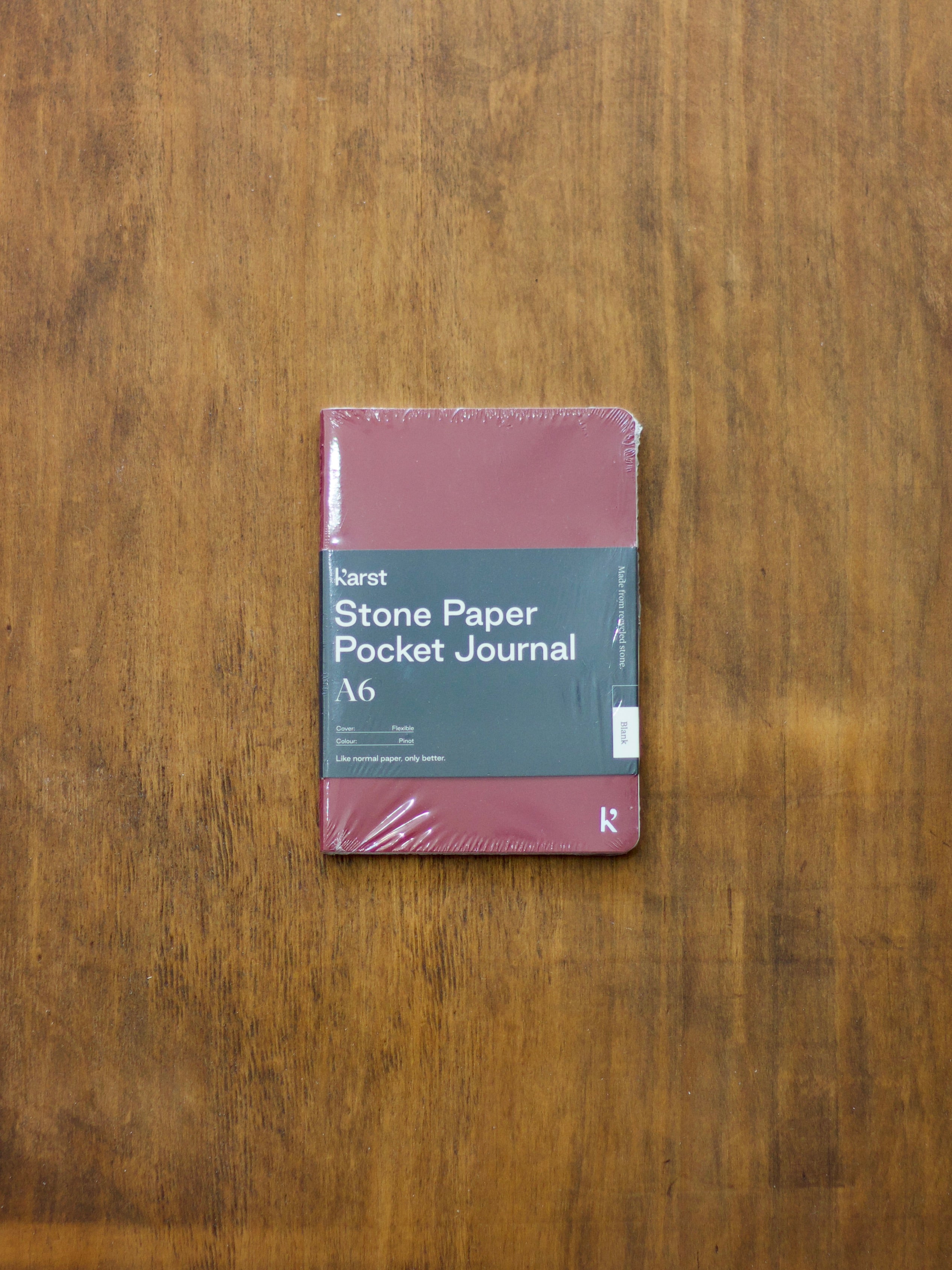 Karst Stone Paper Pocket Journal on a wooden surface