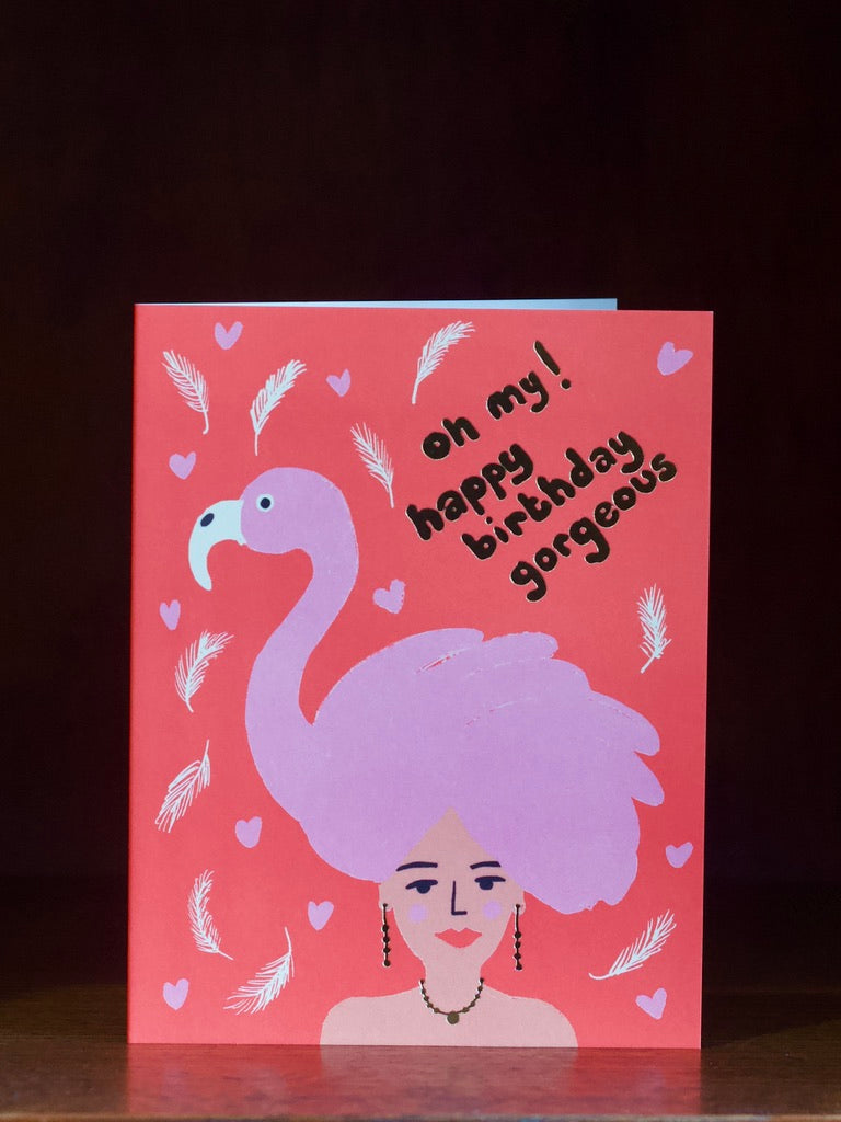 Birthday card with a flamingo and text on a pink background