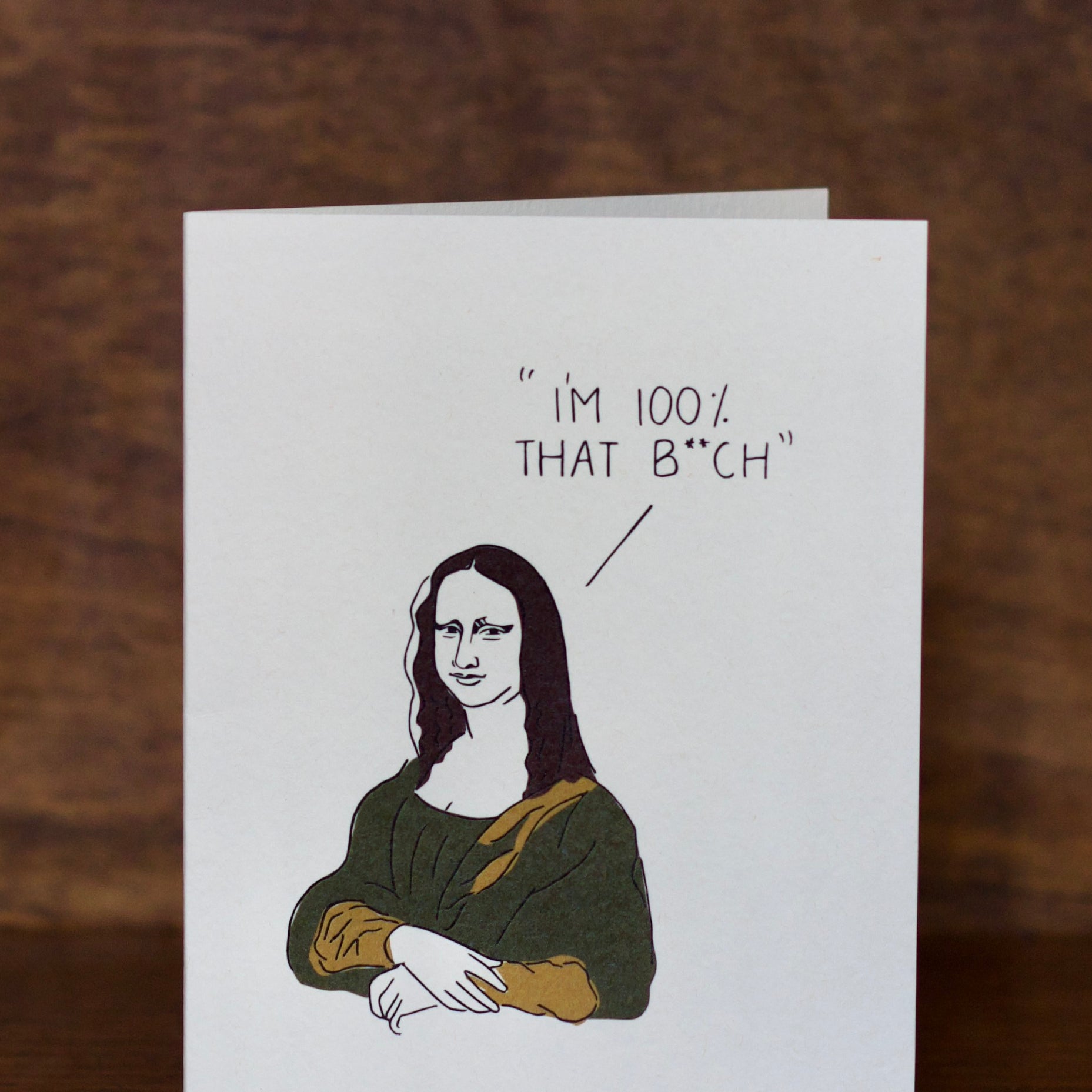 All occasions greeting card with Mona Lisa graphic and text on a wooden surface