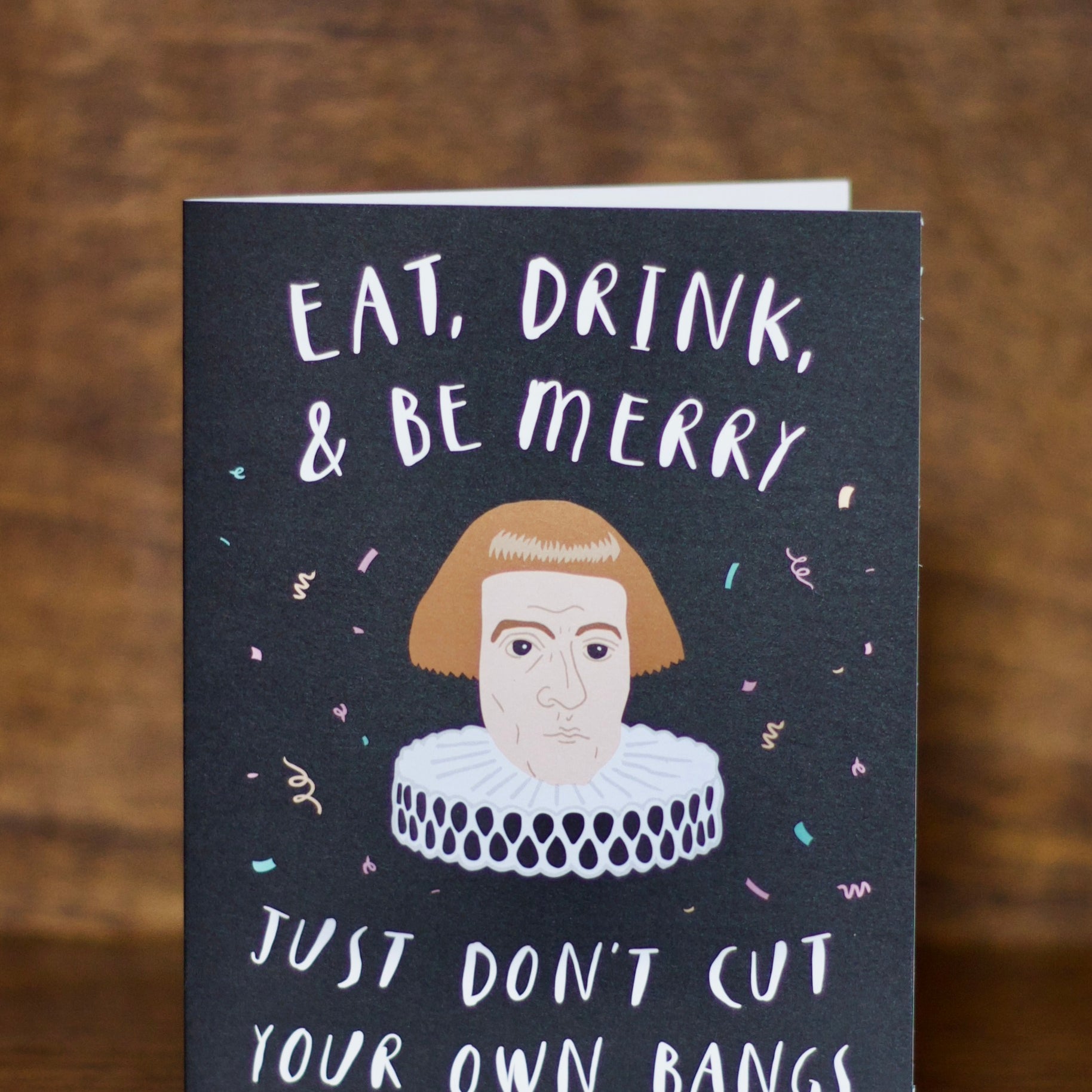 Christmas greeting card with humorous text and illustration of a person with bangs on a dark background