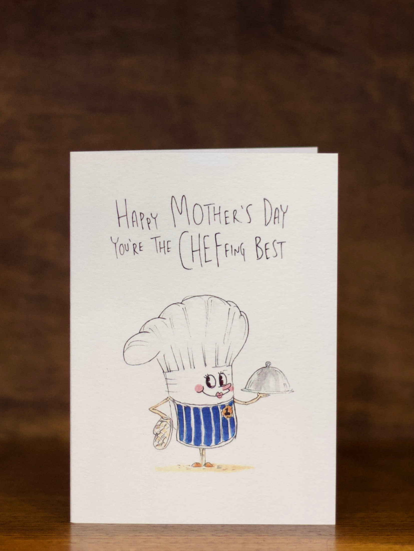 Mother's Day greeting card with a cartoon chef character on a brown background