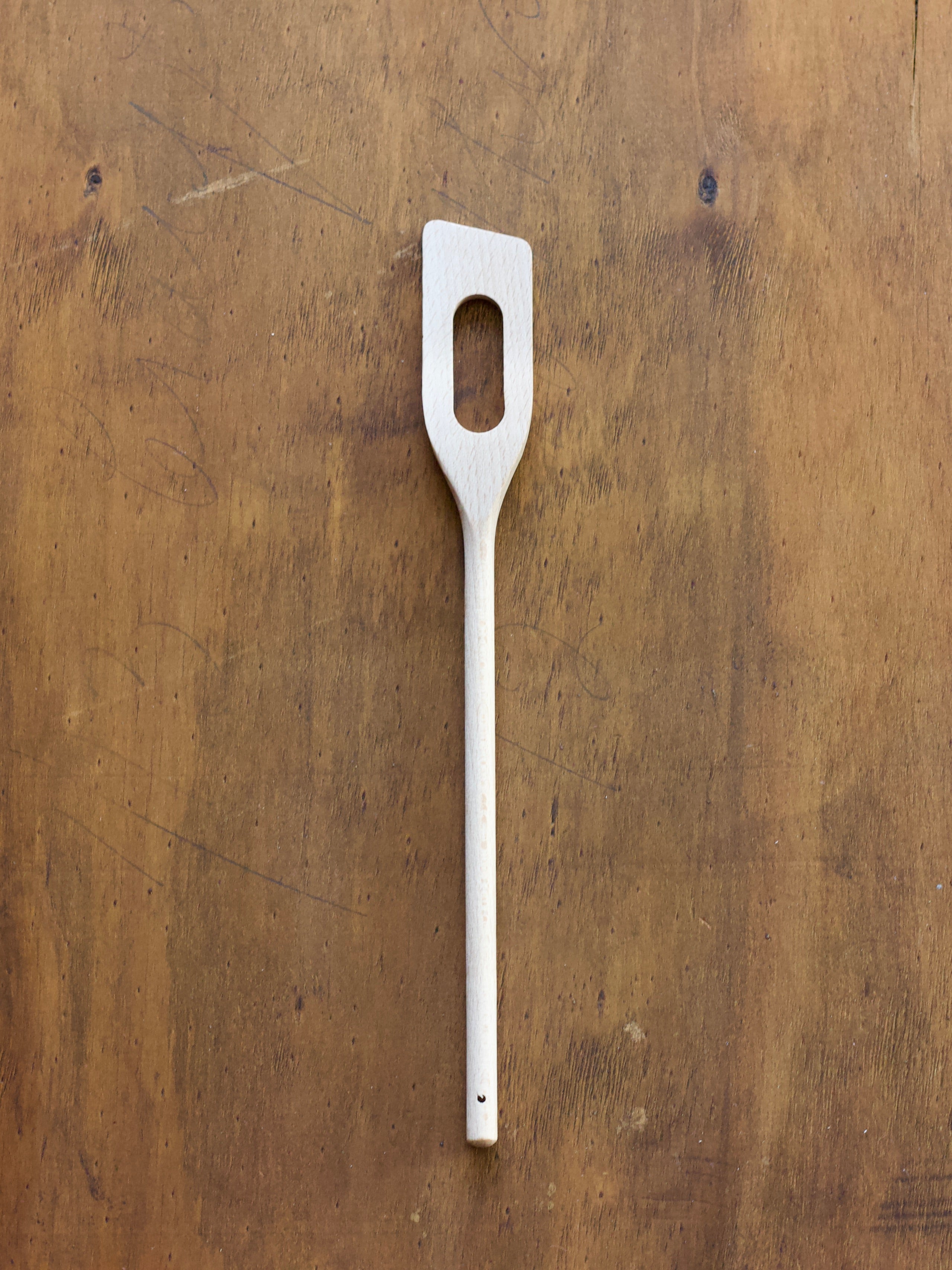 Spatula Spoon on a wooden surface.