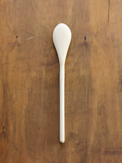 Convex Spoon on a wooden surface