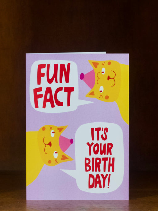 Birthday card with cartoon characters and text 'Fun Fact: It's your birthday!' on a dark background