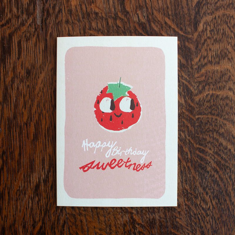 Florence Fry birthday greeting card with a strawberry illustration and text on a wooden surface
