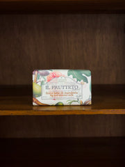 Nesti Dante Il Frutteto fig and almond bar of soap with decorative packaging on a wooden surface