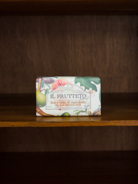 Nesti Dante Il Frutteto fig and almond bar of soap with decorative packaging on a wooden surface