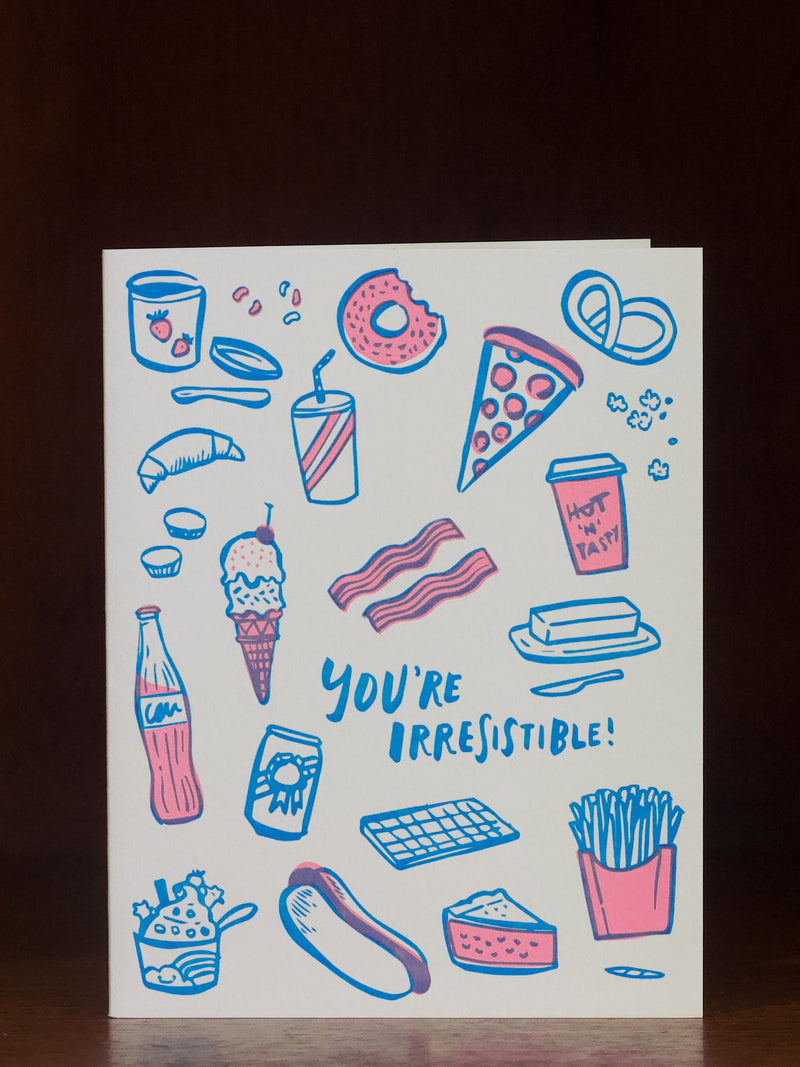 Love greeting card with food illustrations and 'You're Irresistible!' text on a white background
