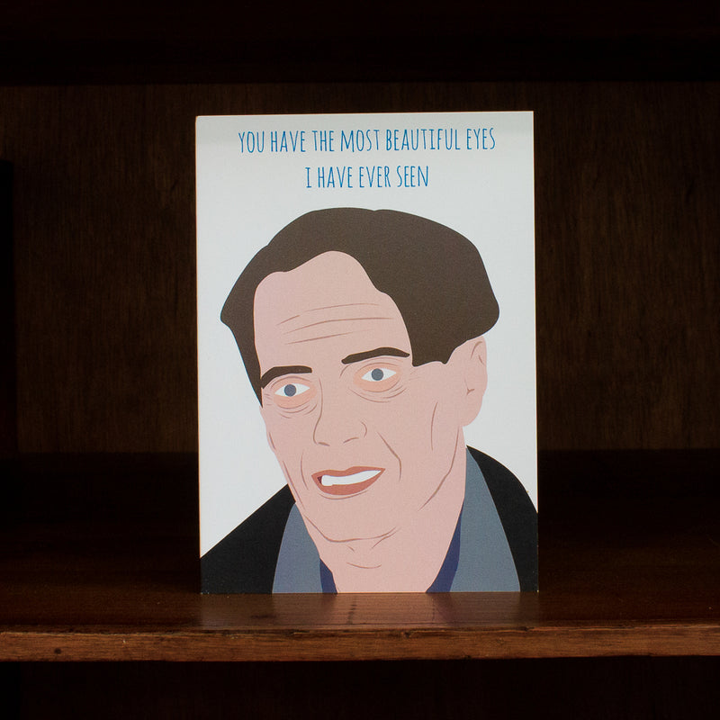 Meet me in shermer greeting card with a cartoon illustration of a man's face and text on a wooden surface