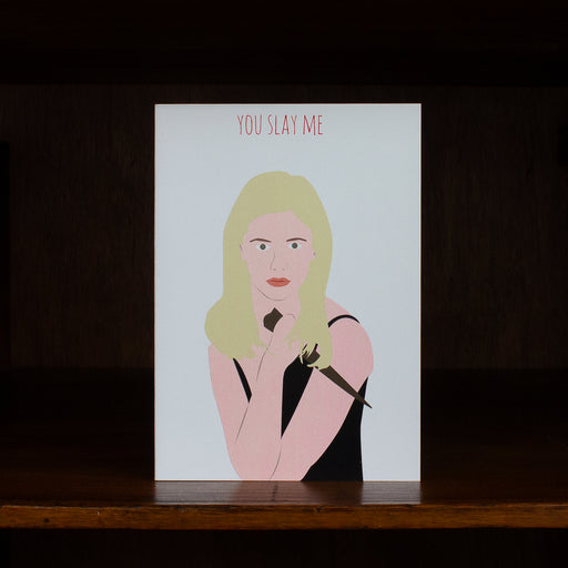 Love greeting greeting card with an illustration of a woman and the text 'YOU SLAY ME' on a white background.