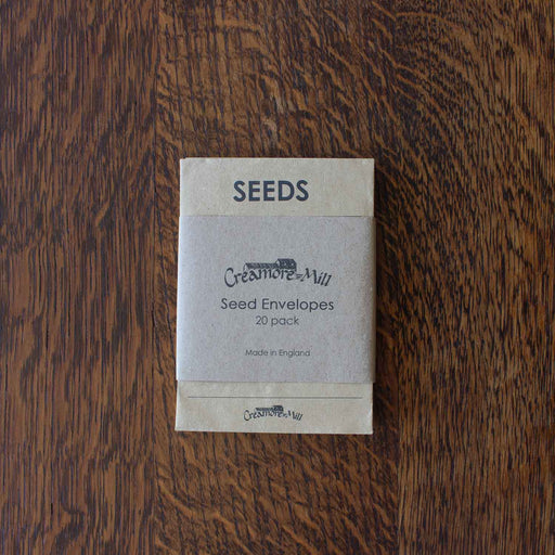 Creemore Mill seed envelopes packaging on a wooden surface