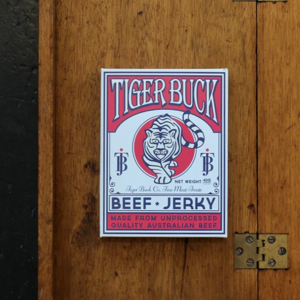 Tiger Buck Beef Jerky on a wooden surface
