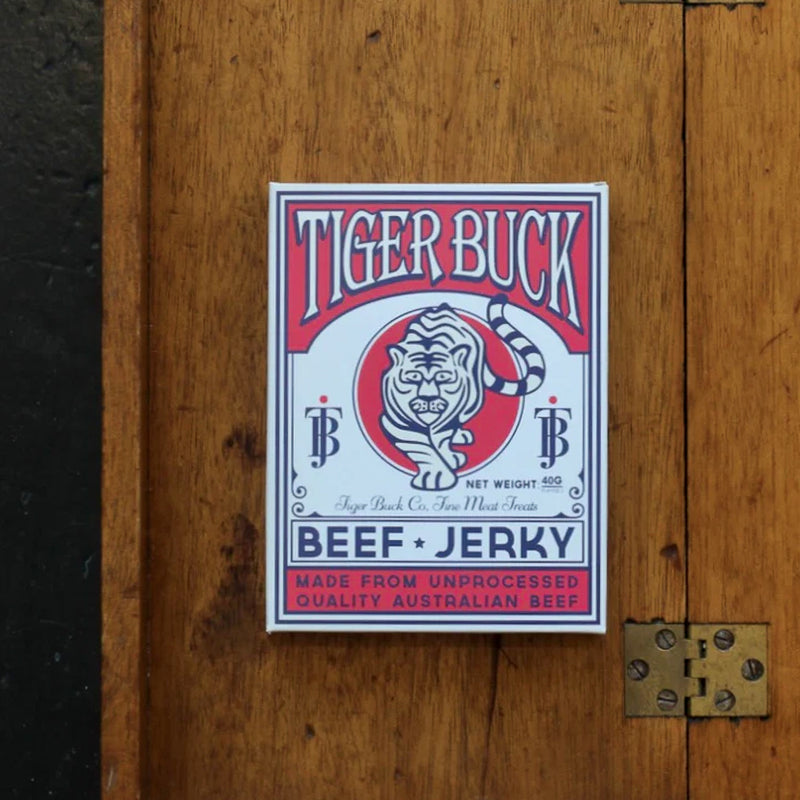 Tiger Buck Beef Jerky on a wooden surface