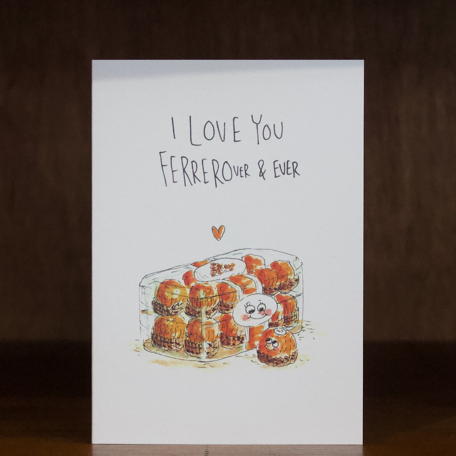 Well Drawn greeting cards with illustration of a box of chocolates and text 'I Love You Ferrerour & Ever' on a wooden surface.